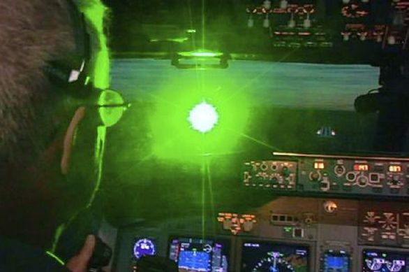 A video still from the FBI shows the blinding effect of laser pointers in cockpits.